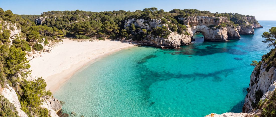 Wide view of Cala Macarella, Menorca, Spain.
