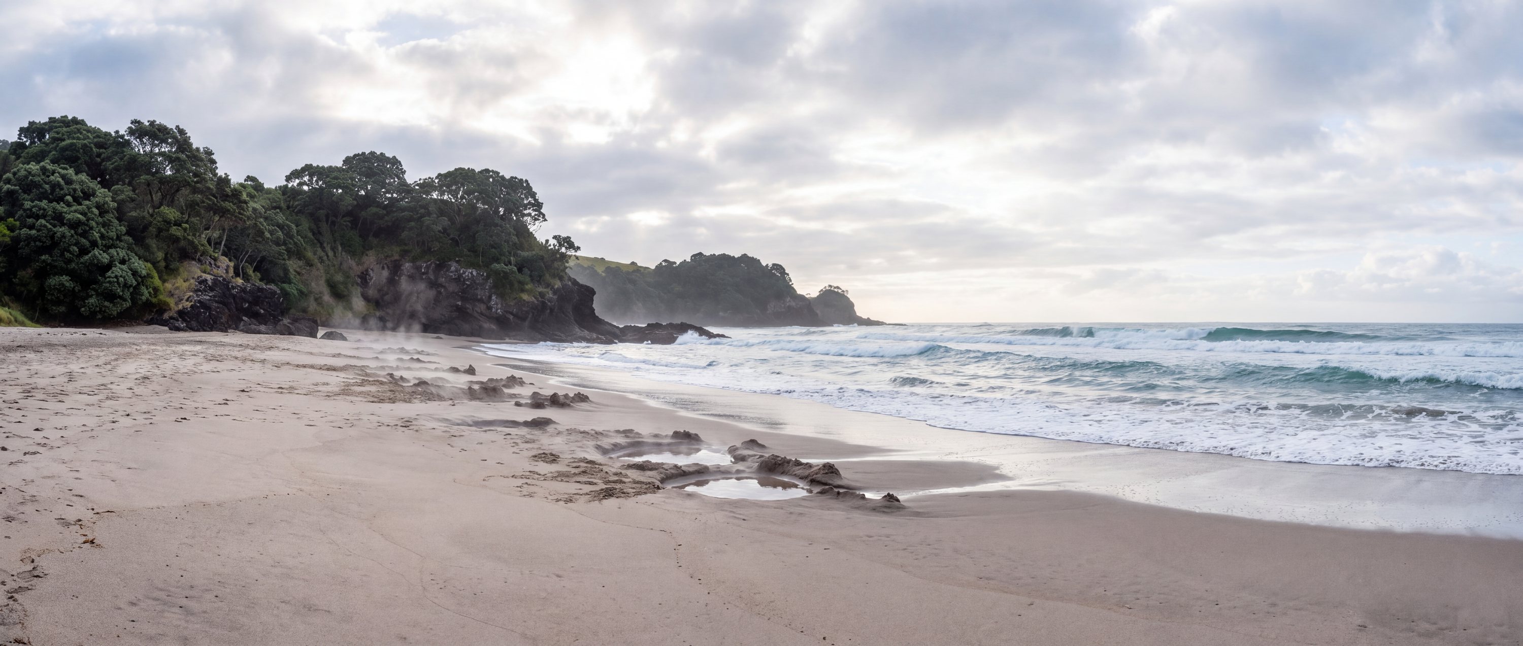 Wide view of Hot Water Beach, Hahei, Coromandel Peninsula.