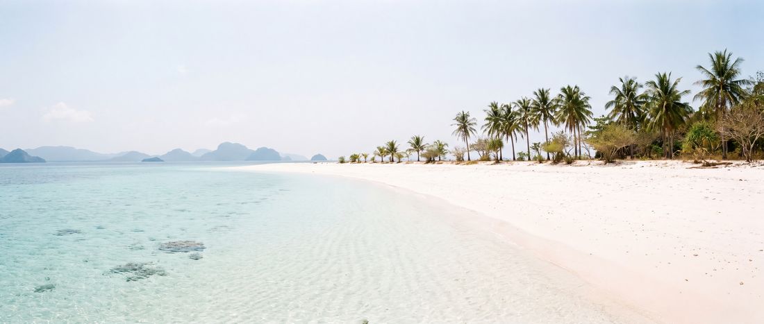 Wide view of Malcapuya Island Beach, Mimaropa.