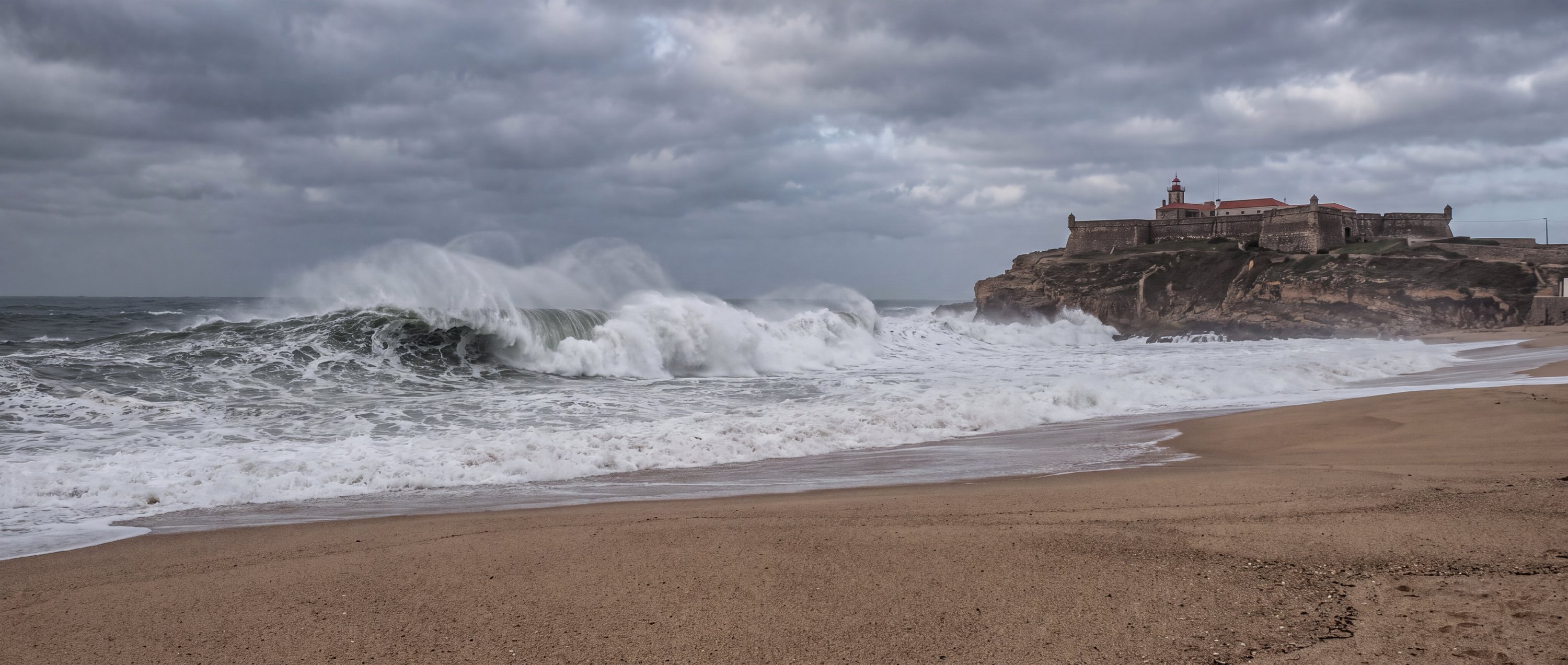 Wide view of Praia do Norte, Nazare, Portugal.