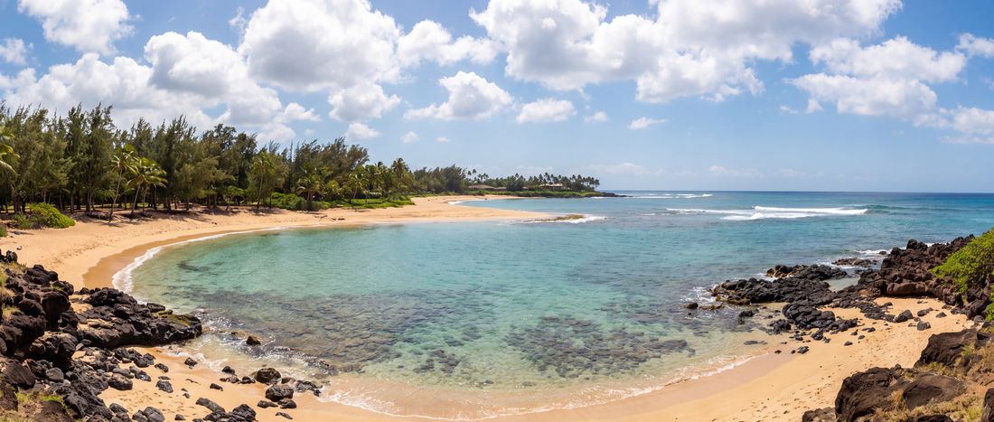 Wide view of Poipu Beach, Kauai, Hawaii.