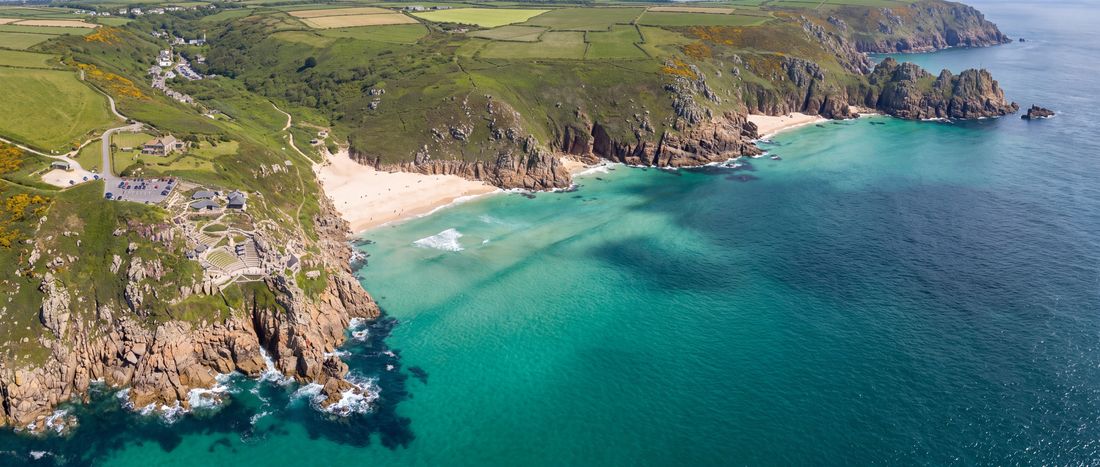 Wide view of Porthcurno Beach, Cornwall, England.