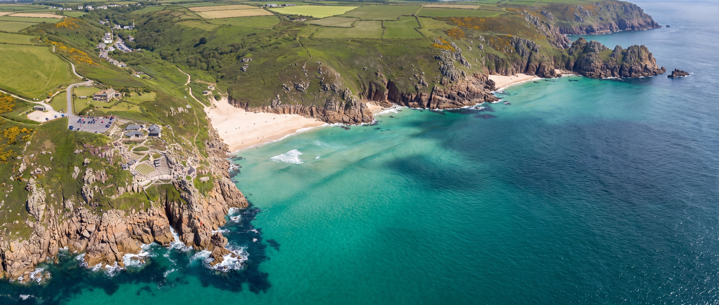 Wide view of Porthcurno Beach, Cornwall, England.