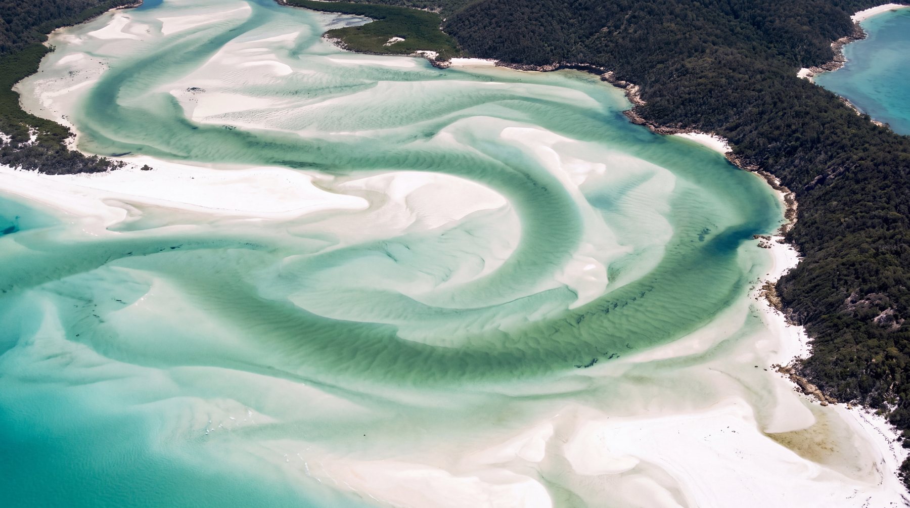 Hill Inlet, where the tide drags the silica sand into ribbons through the shallows.